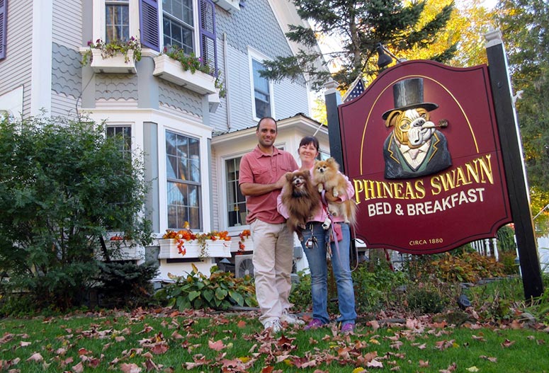 Dog Friendly Bed and Breakfast, Phineas Swan Inn. Couple with dog standing by the sign at this pet friendly bed and breakfast in Vermont.