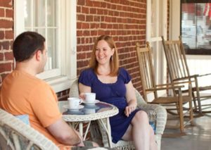 Holladay House Inn, couple sitting on the porch for their honeymoon romantic escape