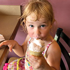 Little girl eating ice cream at breakfast at the Blue Rock bed and breakfast
