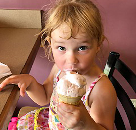 Little girl eating ice cream at breakfast at the Blue Rock bed and breakfast