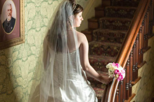 Bride on Garth Woodside interior stairs