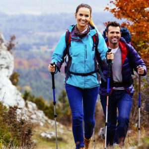 Couple hiking in the fall at a bed and breakfast