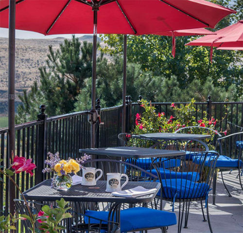 The Vine Restaurant, outside dining with red umbrellas at this Wine Country B&B