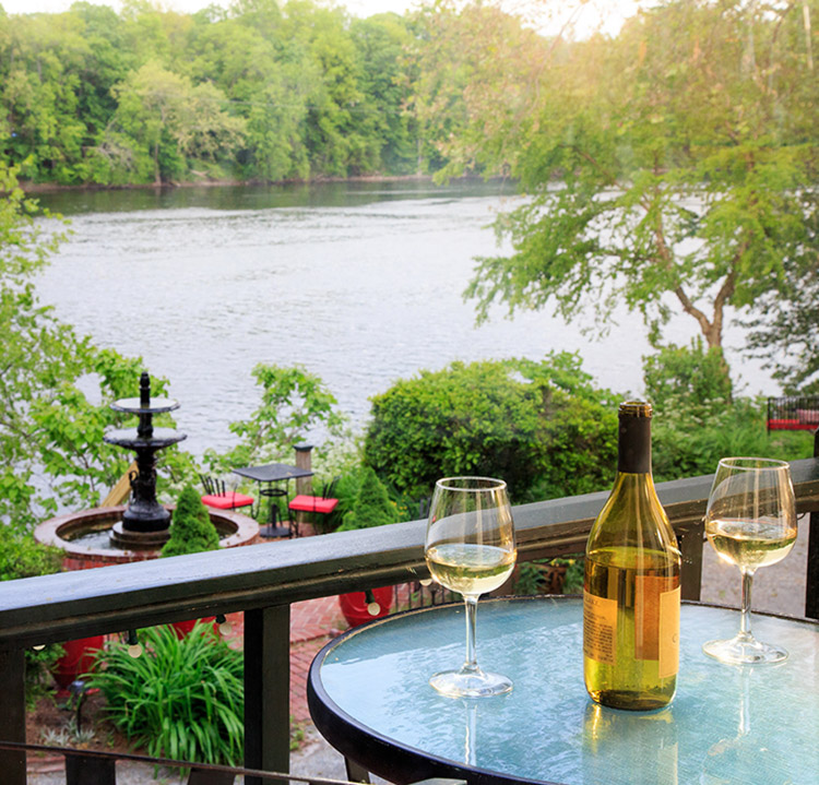 wine glasses and bottle on balcony table